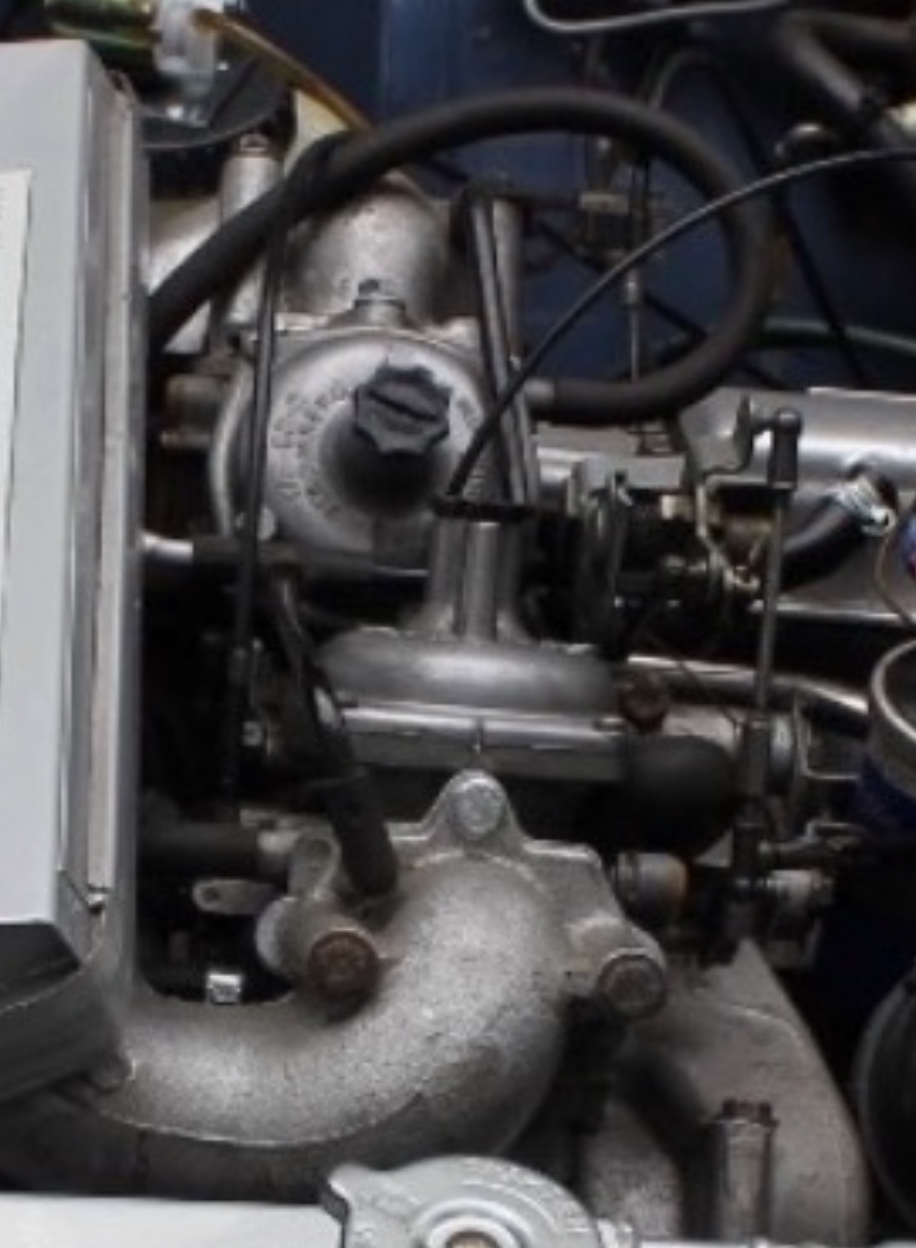 Close-up of a Zenith-Stromberg 175 CD carburettor on a Triumph Stag, showing the dashpot and air-valve chamber.