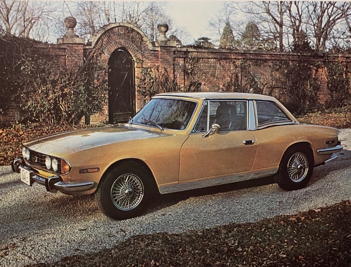 A Triumph Stag with the factory hardtop fitted.