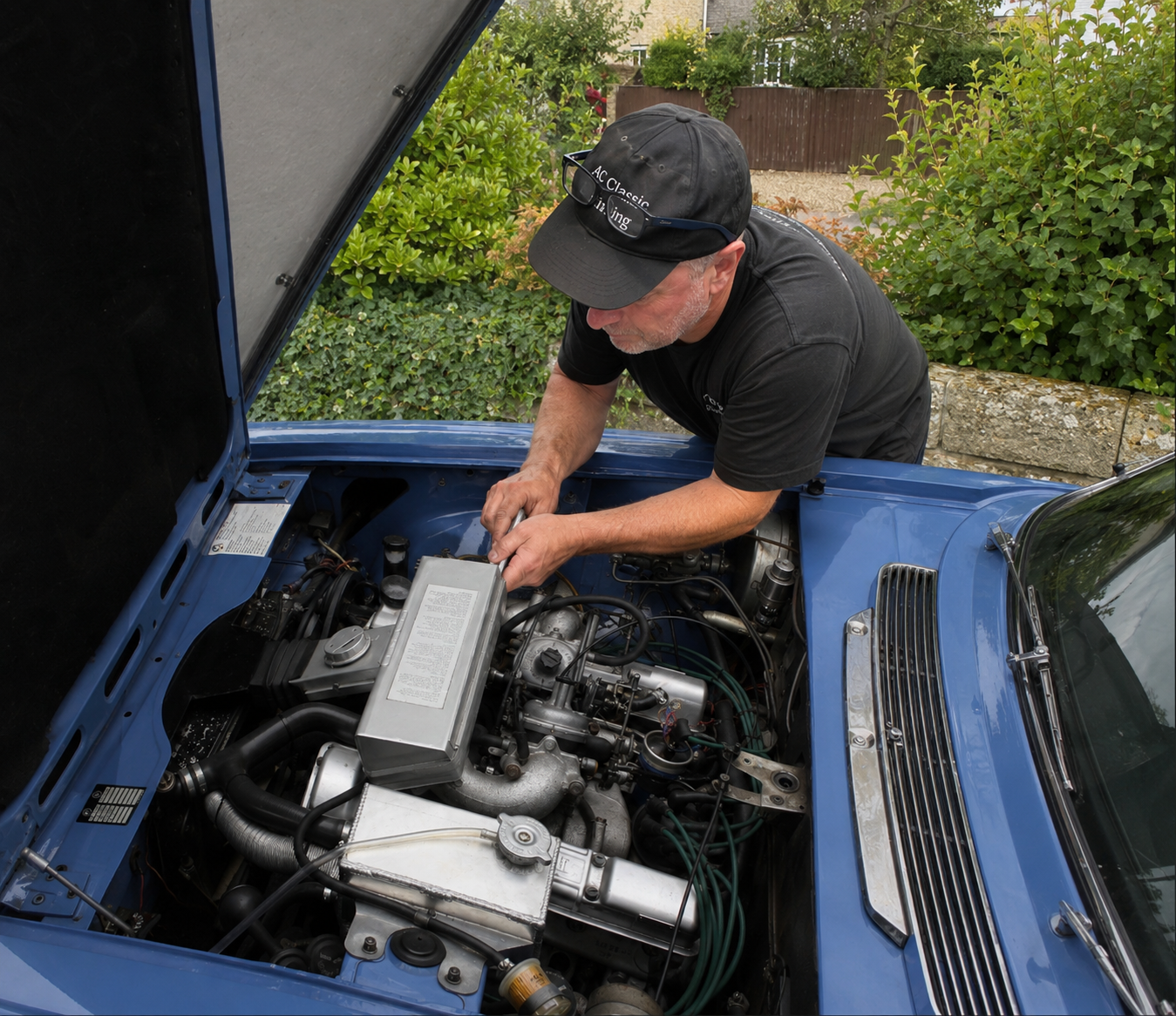 AG Classic Car Tuning specialist working on a Triumph Stag V8 engine bay