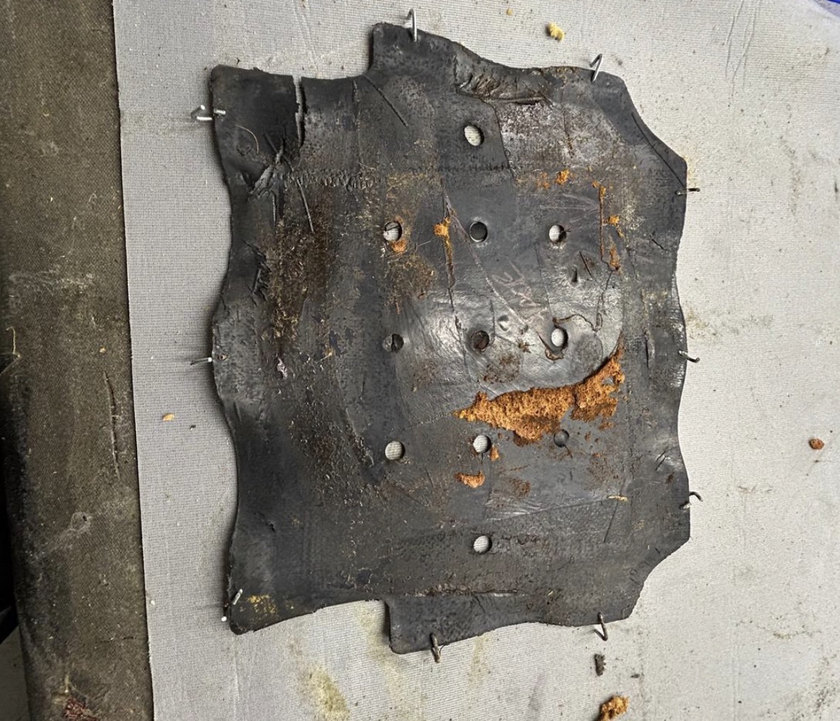 The rubber seat diaphragm removed from KKH 295N, with crumbs of the original foam still on it.