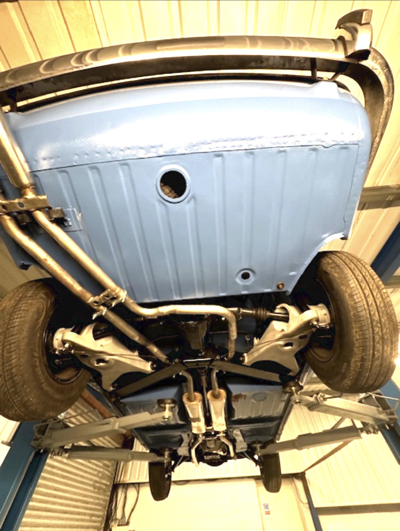 The rear underside of the Stag after coating and rebuild, showing the exhaust and rear suspension.