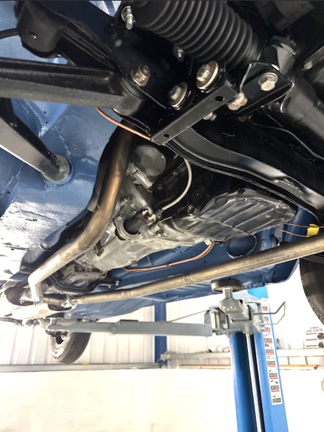 The centre underside of the Stag after coating and rebuild, showing the gearbox and exhaust.