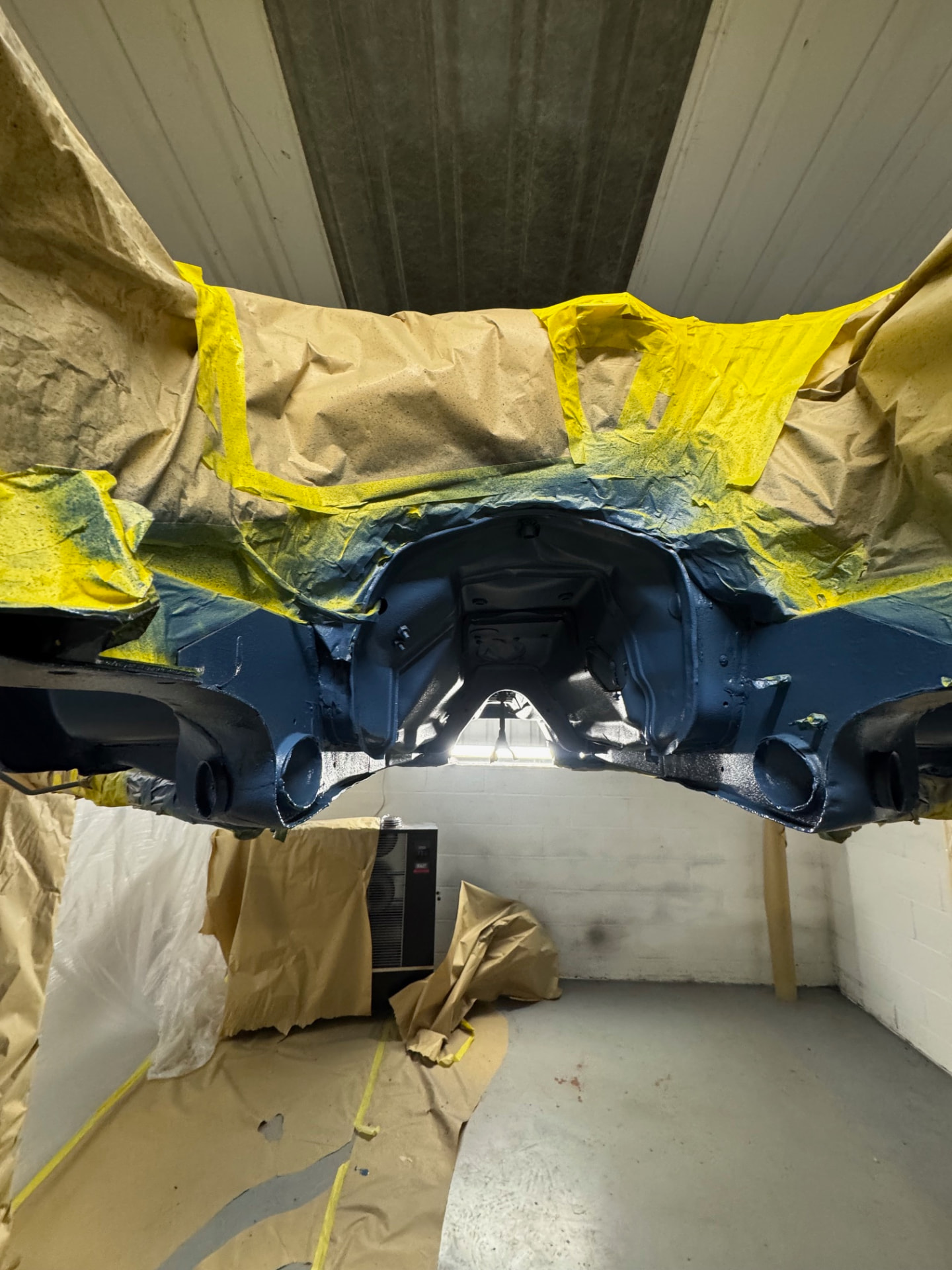 The Stag masked up while the underside was prepared and coated.