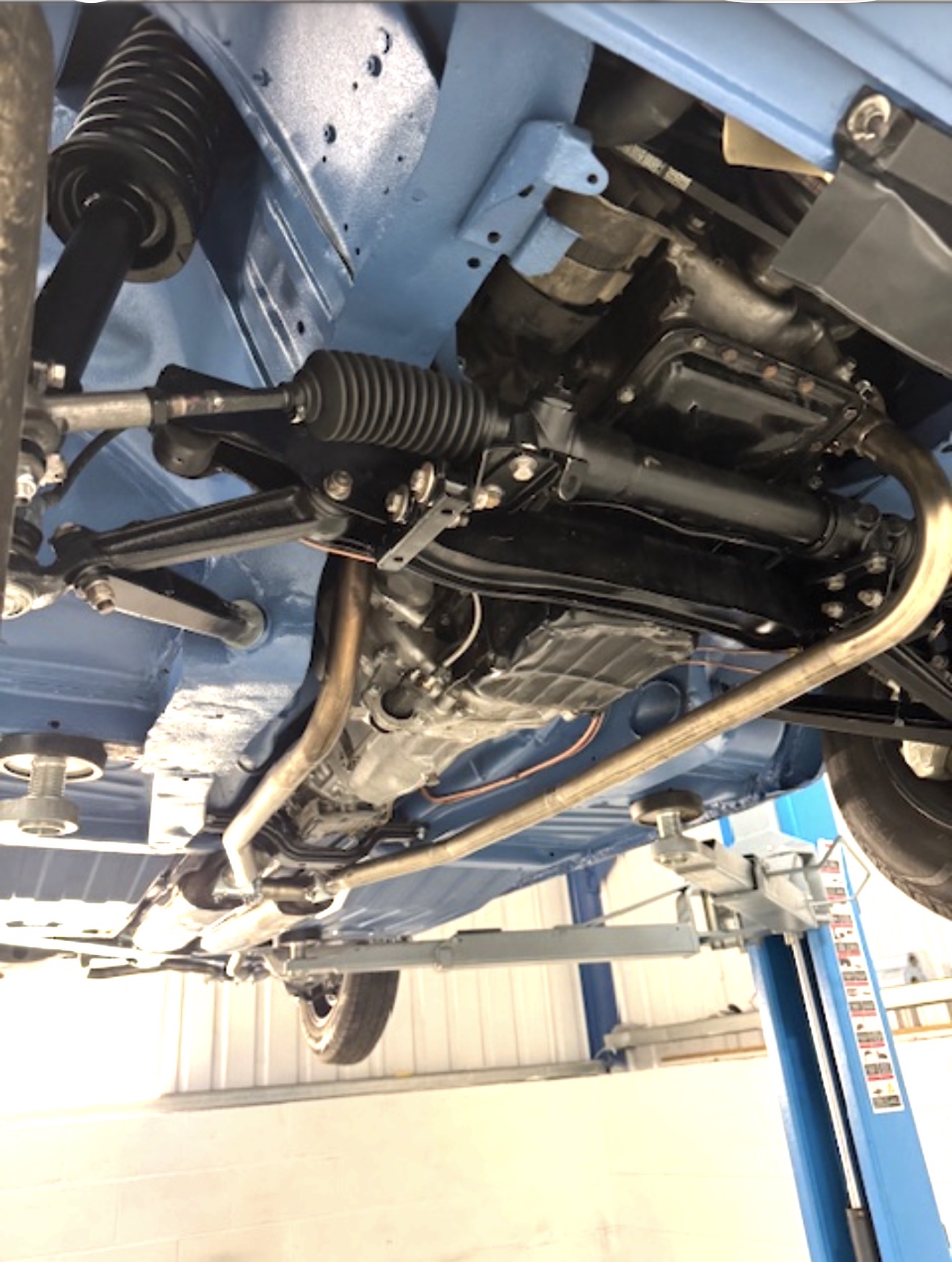The front underside of the Stag after coating and rebuild, showing suspension and steering components.
