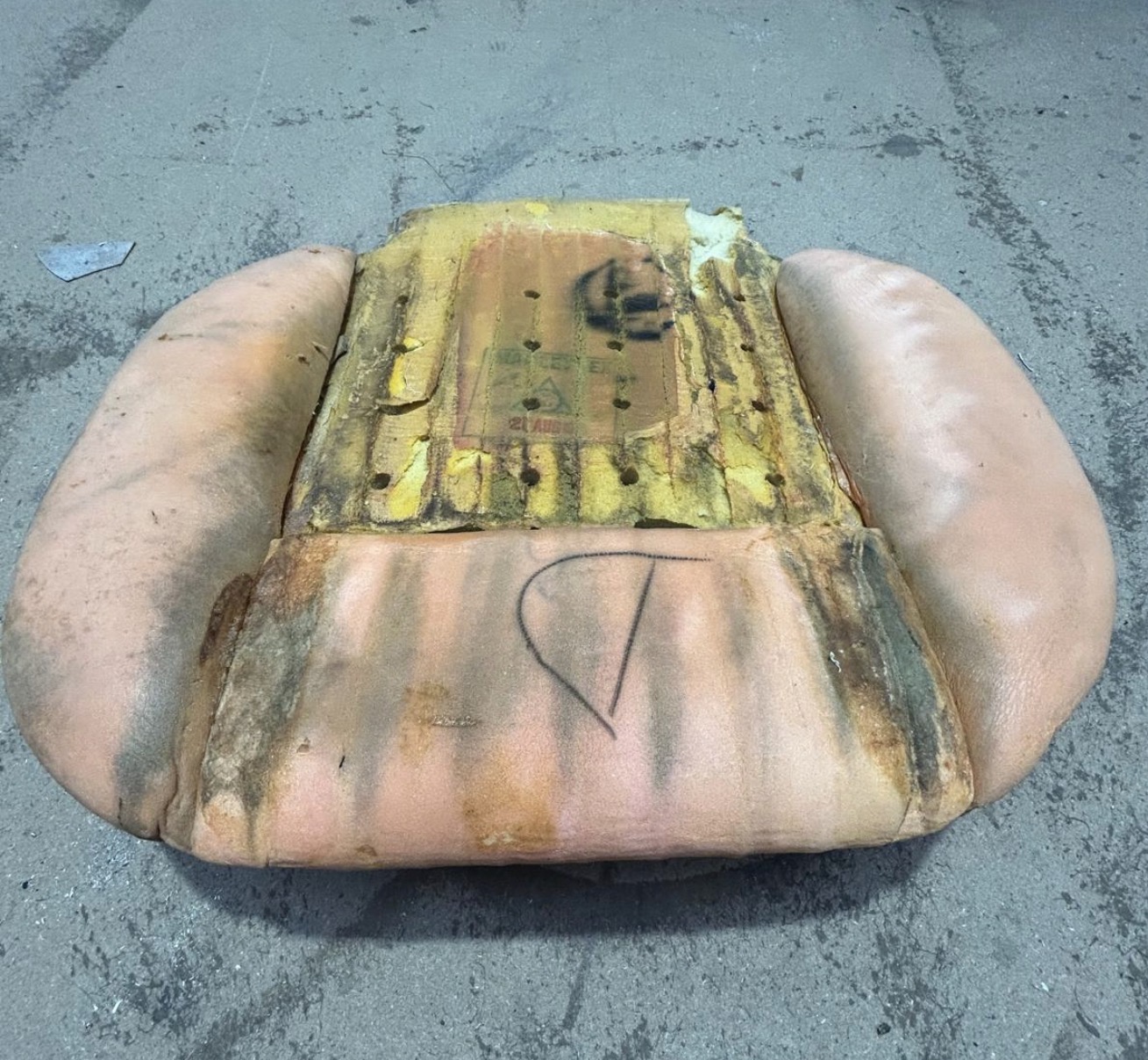 The original base cushion from one of the front seats of KKH 295N, removed from the car and heavily discoloured.