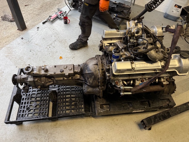 The Stag engine and gearbox removed from the car and placed on a pallet.